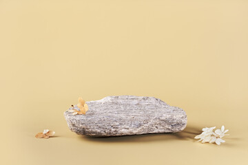Rounded stone and dried flowers. Background for presentation of eco friendly and zero waste...