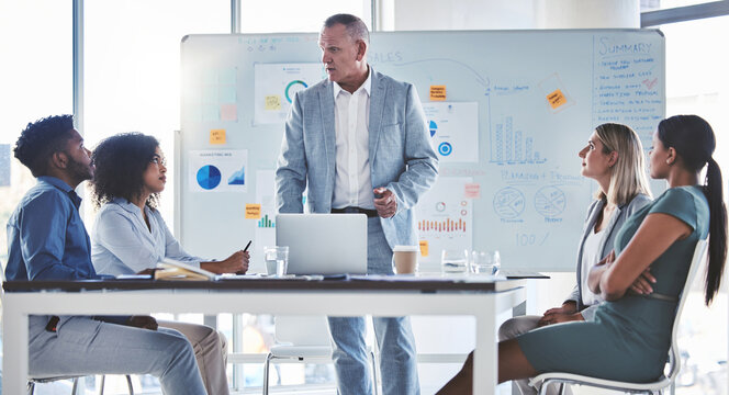 Leader, ceo or boss planning, coaching and teaching an advertising and marketing team in a office. Manager and worker in leadership, team building and management presentation or seminar at work