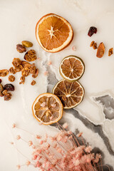 Fototapeta na wymiar Dried lemons and oranges and granola crumbs