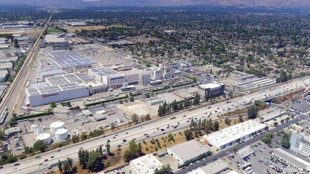 Highway and industrial part of San Fernando with the huge Budweiser Anheuser Busch brewery and warehouse - aerial parallax