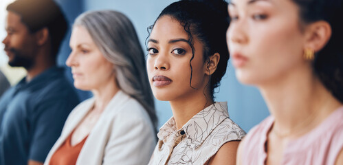 Training, learning and education with a business woman looking serious and sitting in a conference or workshop for coaching. Portrait of a female employee in an audience for a development seminar - obrazy, fototapety, plakaty