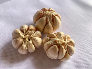 Garlic on a white background. a versatile food ingredient used in many cooked