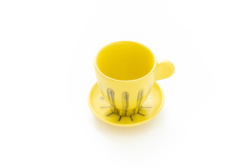 Mug of tea isolated on white background. Ceramic. Product design. Yellow colour. Simplicity. Kitchen wear. Scandinavian style. Daily use. Household. Mug cup.