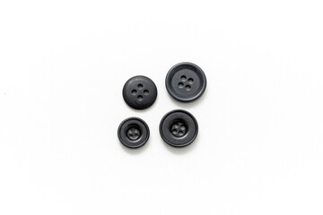 Buttons for sewing isolated on white background. Clothes button. Product. Black buttons.