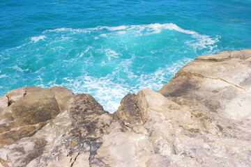 Sea waves greets the rocks at the beach