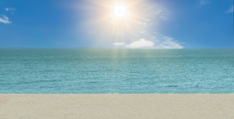 Ocean background with blue sky, sunlight and white sand beach