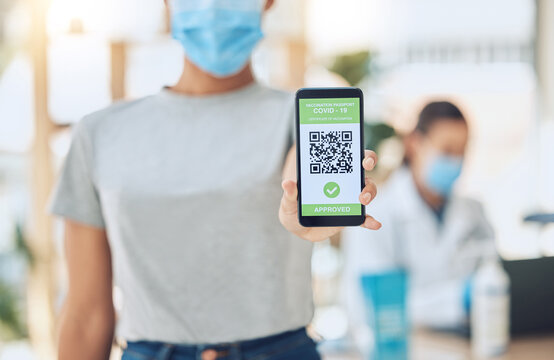QR code for covid vaccine passport and certificate at covid 19 vaccination center or site for health and safety verification. Hands of young girl with smartphone for approval or confirmation document