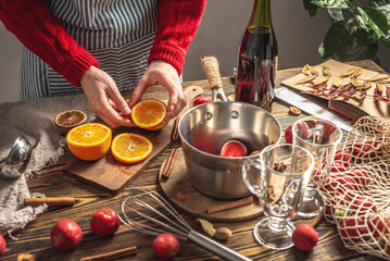 Process of making a warming mulled wine, a cozy festive atmosphere