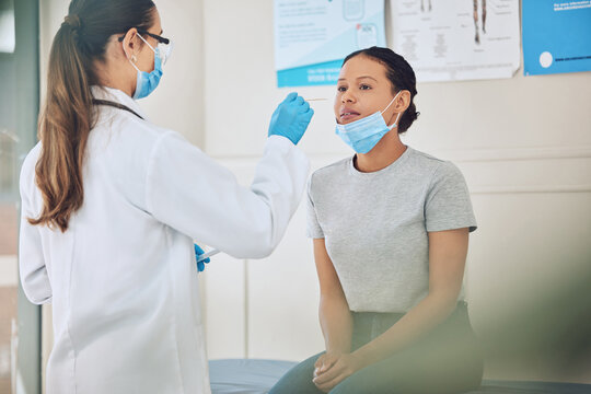 Doctor Or Nurse Doing Covid Test In A Medical Research Facility With With Cotton Swab. A Healthcare Expert Or Worker Testing A Woman Patient For Coron, Virus Or Disease In A Hospital Or Clinic