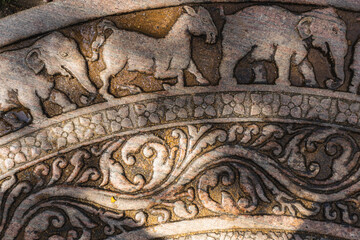 Moonstone also known as Sandakada Pahana, is a unique feature of the architecture of ancient Sri Lanka. It is an elaborately carved semi-circular stone slab, usually placed at the bottom of entrances.