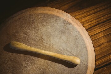 Close-up of wooden bodhran with stick