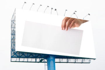 Advertising: Hand holding white empty paper on big billboard on transparent background png file