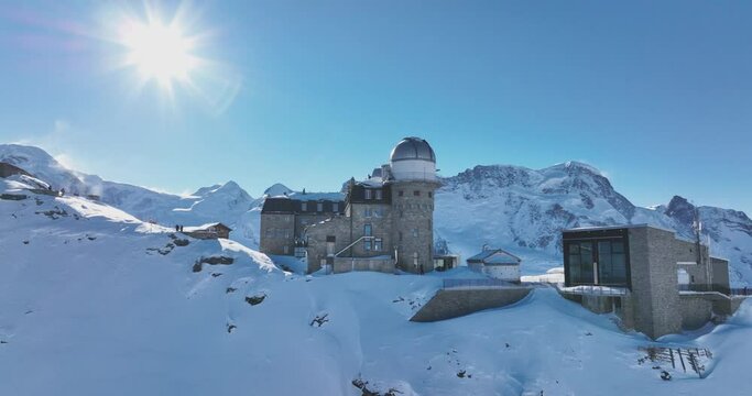 Aerial drone flyover Gornergrat with Matterhorn view during winter in Switzerland. Majestic mountain peaks iconic famous zermatt travel ski resort in the alps. Wonderful inspiring nature landscape.