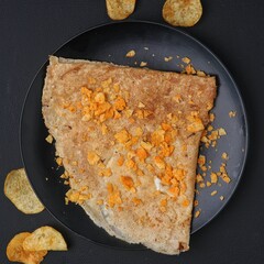 French cuisine, Meals made from flour ready for dish decorated with potato dark food photography. Top view.