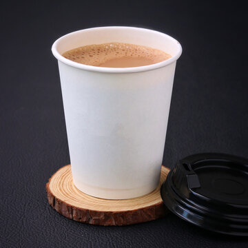 Tea Cup Full Of Tea on a A piece of wood Royalty Free Stock Photo, Picture