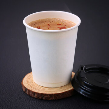 Tea Cup Full Of Tea on a A piece of wood Royalty Free Stock Photo, Picture