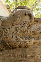 Korawakgala or wing stones are stone balustrades, which are located on either side of the stairs/steps leading to the entrance or door of a religious building or structure.