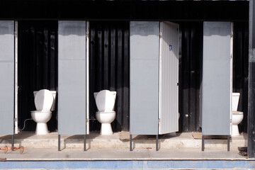 Portable Toilets public in the park.