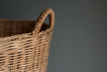 Closeup of wicker made of rattan on a gray background.