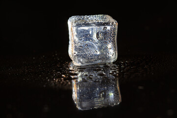 ice cubes on black table background.