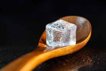 ice cubes on black table background.