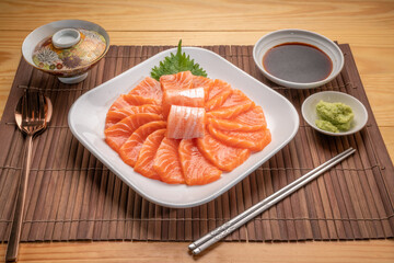 Sliced ​​Fresh Salmon white plate on wooden background, Salmon sashimi salmon sashimi with...