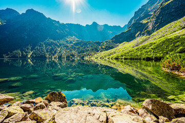 Fototapeta na wymiar Tatra National Park in Poland. Famous mountains lake Morskie oko or sea eye lake In High Tatras. Five lakes valley