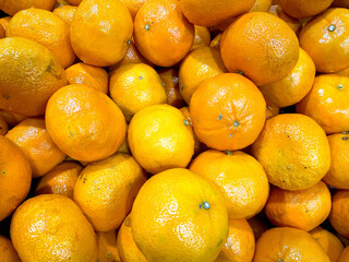 Mandarin orange fruit in the basket at the supermarket