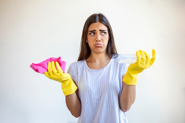 Portrait of young tired woman with rubber gloves resting after cleaning an apartment. Home,...