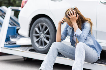 woman calling at roadside car broken for need help while towing service assistance moving her car...