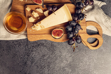 Parmigiano Reggiano the most popular cheese whith fruits , honey and figs