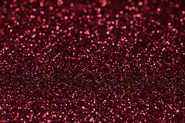 Extreme close-up, flat piece of sparkly, vibrant, red, coloured craft paper, very shallow...