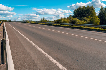 Empty asphalt road ground with metal safety barrier