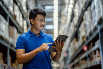 Warehouse Worker using digital tablets to check the stock inventory on the shelf in large warehouses, a Smart warehouse management system, supply chain and logistic network technology concept.