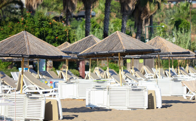 Sunbeds with sun loungers on the beach