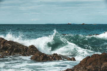 waves crashing on rocks