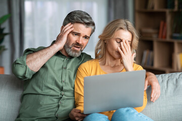 Infidelity Concept. Depressed wife catch husband's correspondence with another woman on laptop