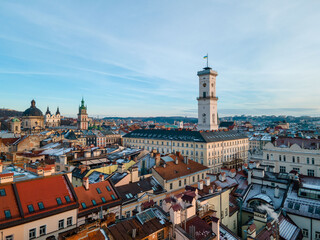 aerial view of lviv city hall on sunset