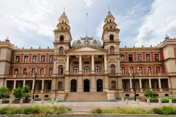 Fototapeta na wymiar Frontal view of the Palace of Justice building on Church Square in Central Pretoria, South Africa, shot against a cloudy sky