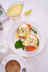 Eggs Benedict with Cream cheese and Smoked salmon on a plate
