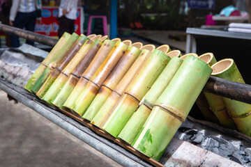 Sticky rice cooked in a bamboo tube by adding coconut milk and then burning until cooked,Khao Lam...