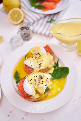 Eggs Benedict with Cream cheese and Smoked salmon on a plate