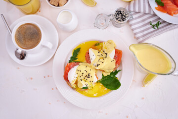 Eggs Benedict with Cream cheese and Smoked salmon on a plate