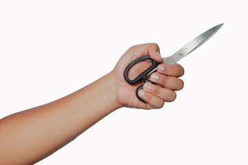 a person's hand is holding a pair of scissors, the concept of being defensive or threatening. photo...