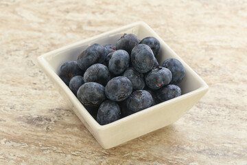 Sweet ripe blueberry heap in the bowl