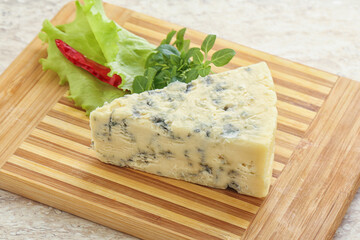 Blue cheese piece over board
