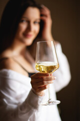 Photo of happy woman holding wine glass and smiling 