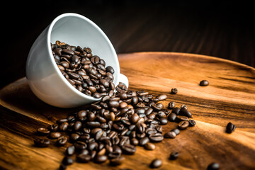  coffee beans  .cup of coffee beans on wooden plate backgrond. .