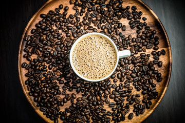 coffee beans. Indian filter coffee. Indian coffee .cup of coffee with coffee beans on wooden plate background top view . 