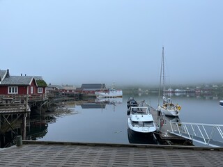 Fototapeta premium Boats pier in the fog, misty seascape